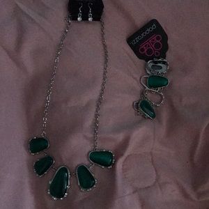 Necklace comes with earrings and a matching bracelet dark green.